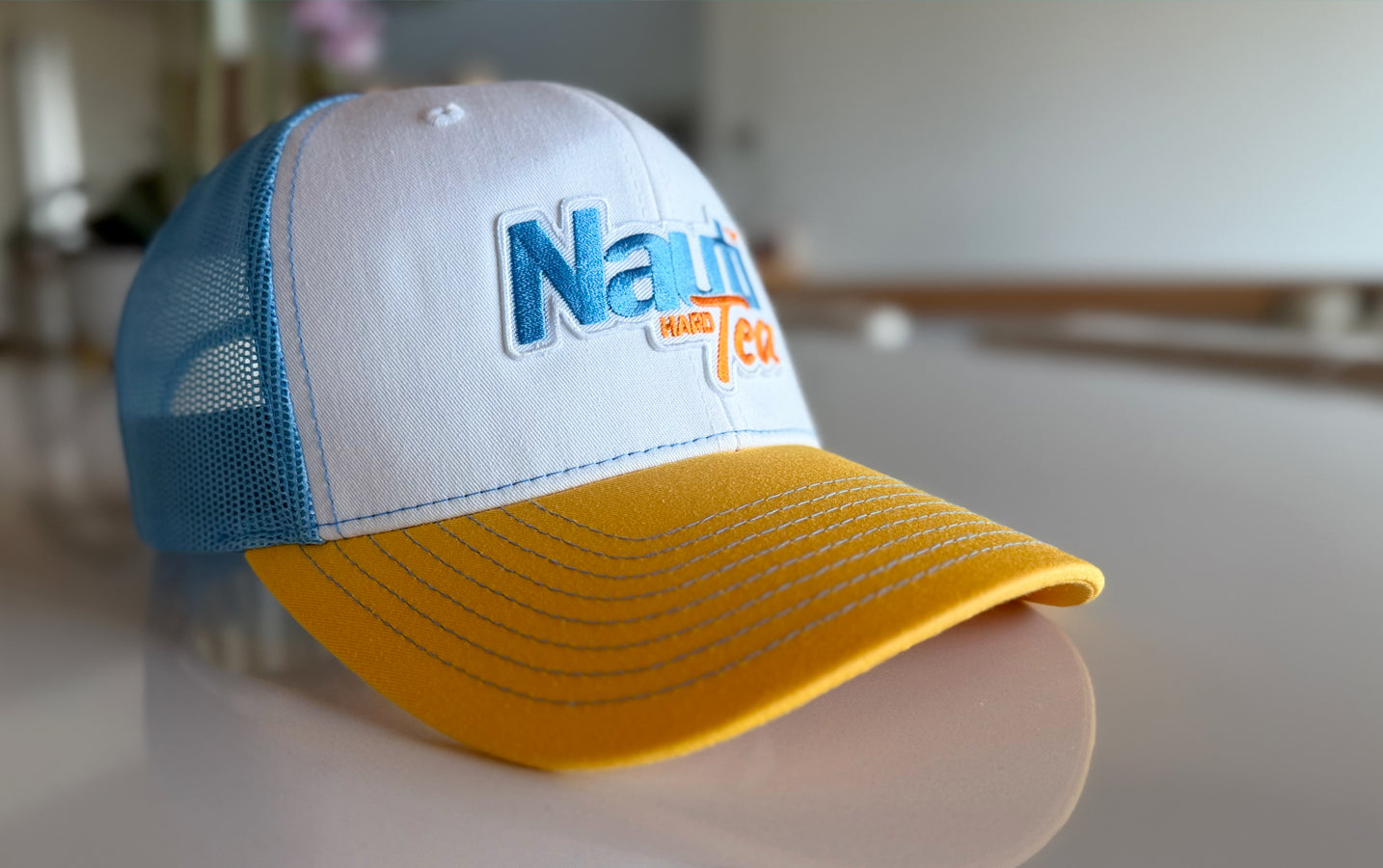 Nauti Tea© Richardson 112 Patch Trucker Hat – White/Yellow/Blue
